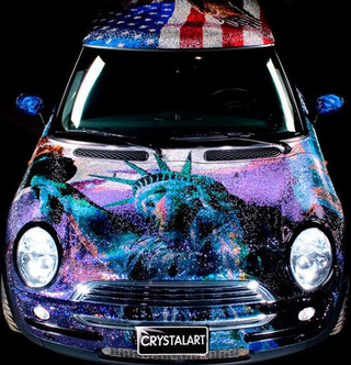 Illustration for article titled Mini Cooper Covered In One Million Swarovski Crystals... Is Proud To Be An American?